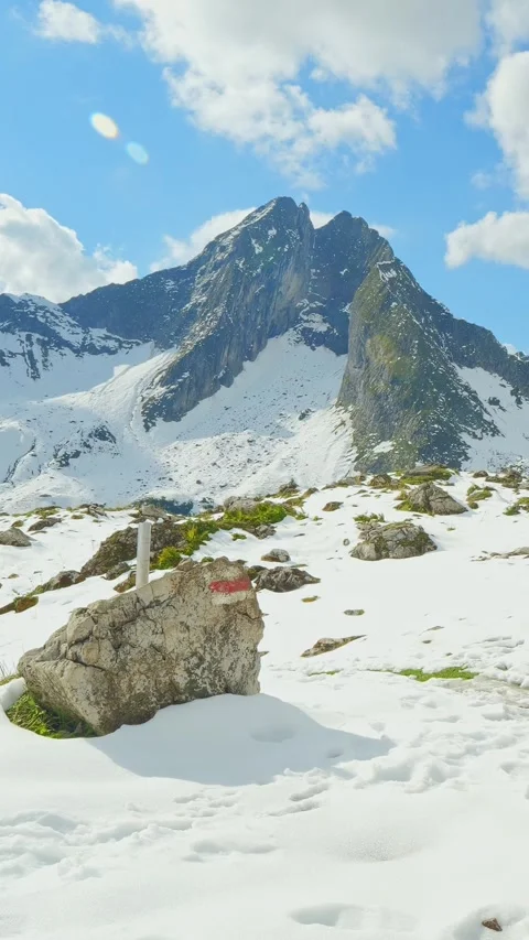 Snow Traces Curve Through a Winter Wonderland of Rock and Silence near Jochsp Stock Footage 308296293