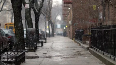 Snow tumbling down on cold winter Brooklyn street, in New York - Long Stock Footage 147219017