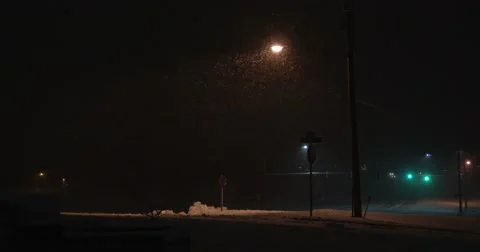 Snow Under Street Light - Intersection - 4k Stock Footage 58668694