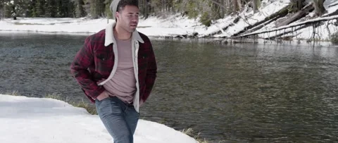 Snow Walk by Mountain River   Video stock 243761778