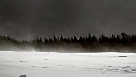 Snow Whispers: Drifting Fields in Slow Motion watched by dark skies Stock Footage 303176317