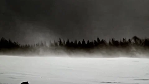 Snow Whispers: Drifting Fields in Slow Motion watched by dark skies Stock Footage 303176965