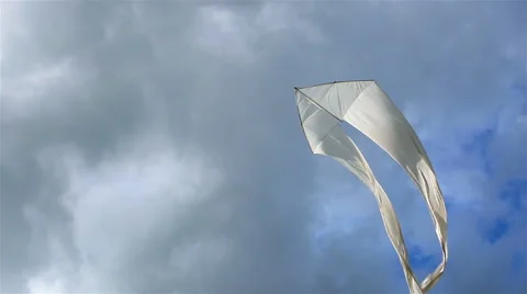 Snow-white kite soars in the sky Stock Footage 50574190