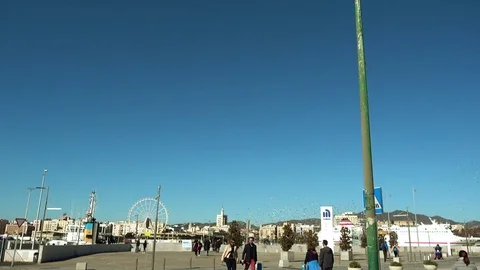 Snow-white lighthouse in Malaga on waterfront Stock Footage 73570533