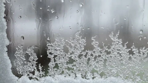 Snow on window 0345 reverse x4 Stock Footage 144695121