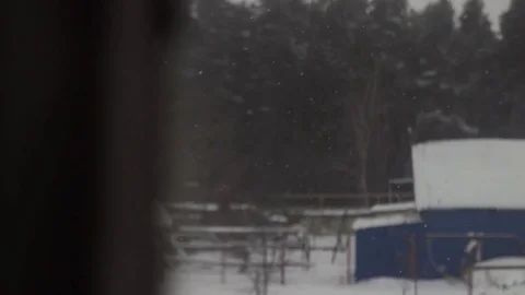 The snow from the window at the blurred forest background horror Stock Footage 71361748