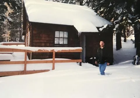 Snow at winter cabin Stock Photos