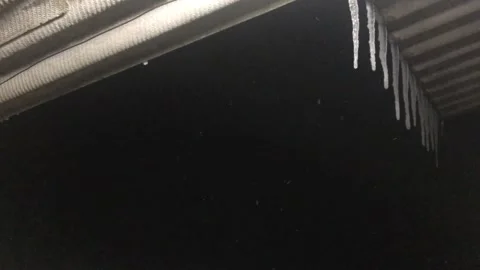 Snow At Winter night , Wind blows , triangular roof &amp; icicles hang 2 Stock Footage 168014086