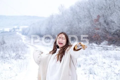 Snowball game. Playing with snow and having fun in winter park. Activity smiling Stock Photos