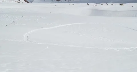 Snowball rolls down the slope Panorama of rocky snowy mountains Tuyuk-Su glacier Stock Footage 145113931