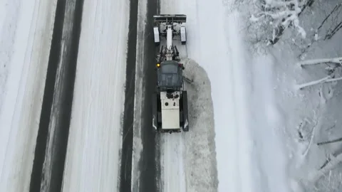 Snowblower cleans snow on the track. 스톡 동영상 168094801