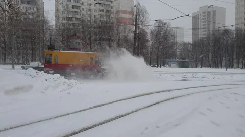 A snowblower clears tram tracks. Stock Footage 147526233