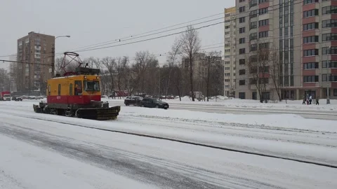 A snowblower clears tram tracks. Stock Footage 147526532