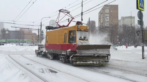 A snowblower clears traumatic paths. Stock Footage 148373090