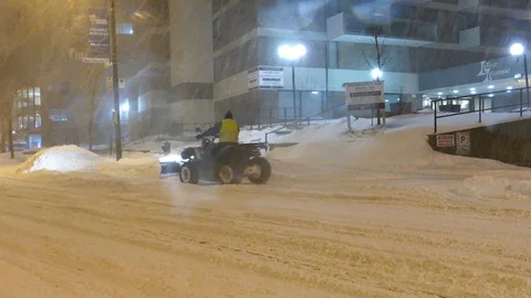 Snowblower on VTT during snow storm Stock Footage 105287343