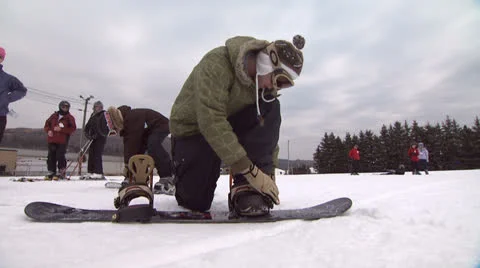 Snowboard and Skier Getting Ready Stock Footage 26070353