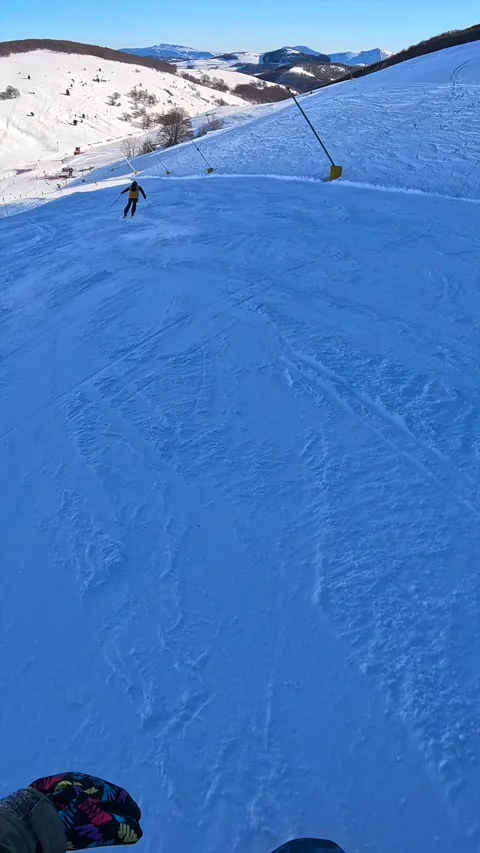 Snowboard chasing on a slope - vertical POV Stock-Footage 296799035
