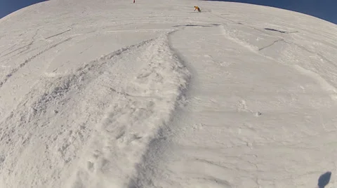 Snowboard man ride in front of the camera making the wave of snow Stock Footage 36020642