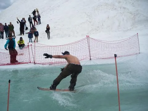 Snowboard water competition guy without T-shirt at the ski resort Gorky-gorod Stock Photos