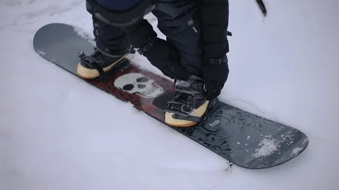 Snowboarder Adjusting Straps Stock Footage 101850755