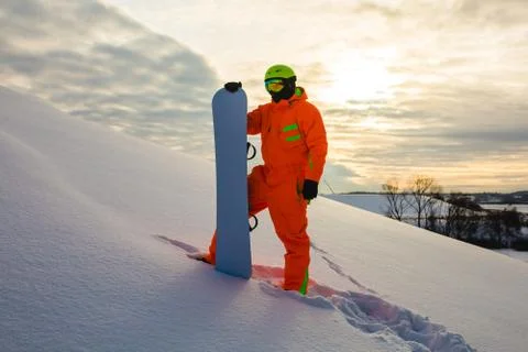 Snowboarder at the background of sunset Stock Photos