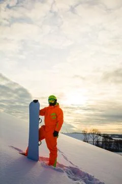 Snowboarder at the background of sunset Stock Photos
