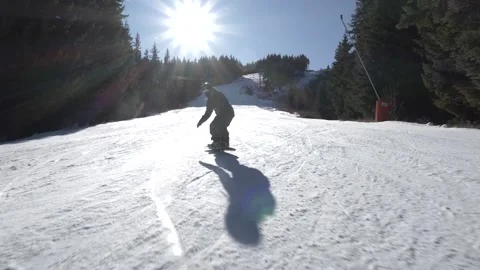 Snowboarder carving downhill Stock Footage 222362074