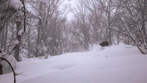 A snowboarder charges down the mountain Stock Footage 138490074