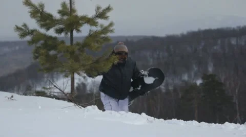Snowboarder Climbs up Stock Footage 10885100