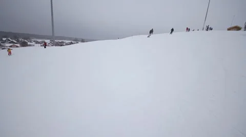 Snowboarder coming down on a snowboard Stock Footage 1060404
