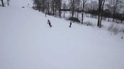 Snowboarder coming down on a snowboard Stock Footage 1060416