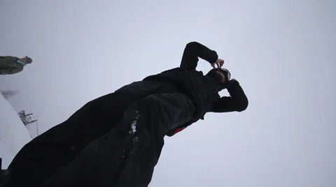 Snowboarder coming down on a snowboard Stock Footage 1060418