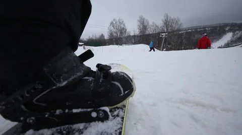 Snowboarder coming down on a snowboard Stock Footage 1060419