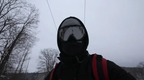 Snowboarder coming down on a snowboard Stock Footage 1060444