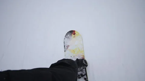Snowboarder coming down on a snowboard Stock Footage 1060447
