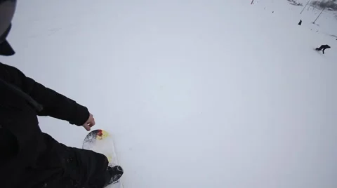 Snowboarder coming down on a snowboard Stock Footage 1060449