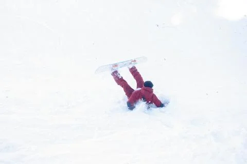 Snowboarder crashed in the snow Stock Photos