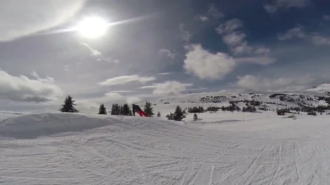 Snowboarder doing 540 jump Stock Footage 74537660