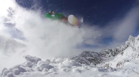 Snowboarder doing a backflip on mountain Stock Footage 55339568