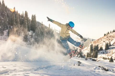 Snowboarder doing his trick method with nose grab Foto stock