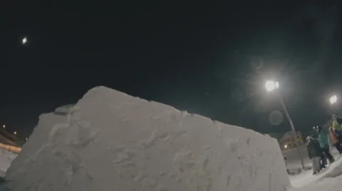Snowboarder doing trick on the kicker Stock Footage 64869911
