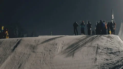 Snowboarder doing trick on the slope Stock Footage 64870082