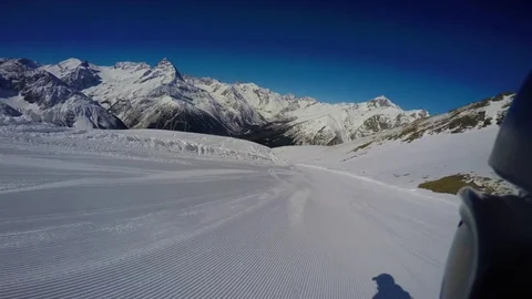 Snowboarder falls on a prepared slope. First person view Video stock 74311900