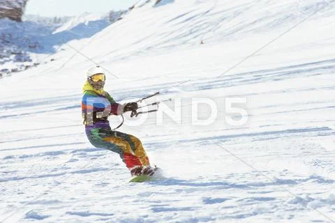 Snowboarder girl kiting snowboarding sports Stock Photos