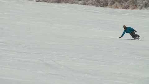 Snowboarder glides down an empty ski field Hakuba Japan. Stock Footage 166369694