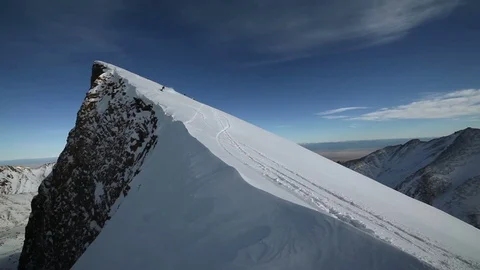 Snowboarder goes down the mountain slope Video stock 70295458
