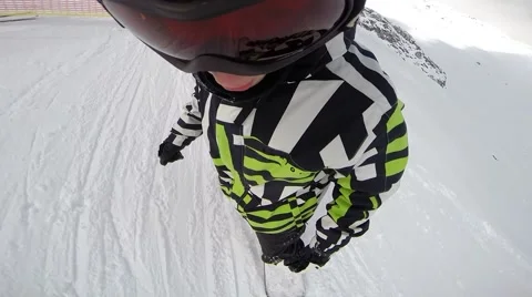 Snowboarder going down a race track Stock Footage 50549677