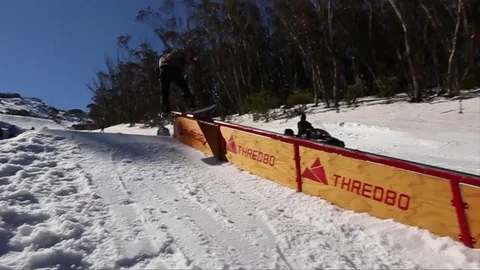 Snowboarder Grinding on a bar on the snow - Version 2 Stock Footage 81498669