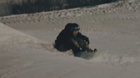 Snowboarder has a rest on the slope Stock Footage 64870096