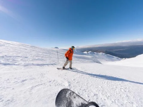 Snowboarder hit the slope Stock Photos
